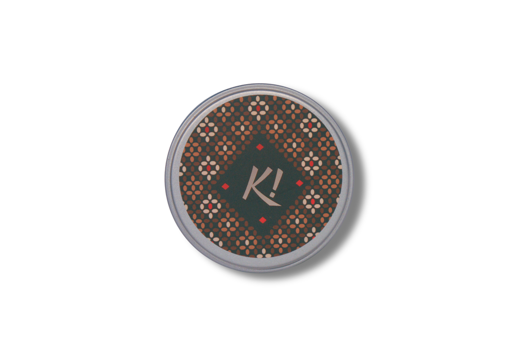 Top view of Kwanzaa! Kawaida Black Tea label and loose leaf Kenya single-origin tea